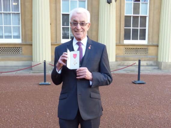 Peter Farrer with his MBE.