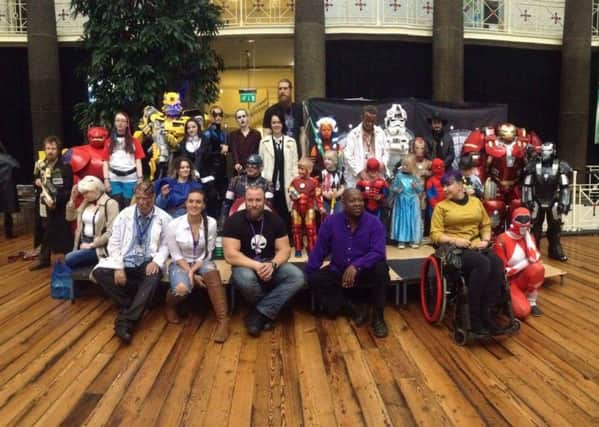 A team effort as cosplayers unite, showing the many different sides to a comic convention.