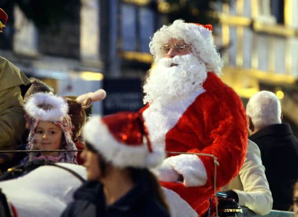 Santa Claus makes his way thorugh Matlock town centre at the annual Matlock Victorian Christmas Market.