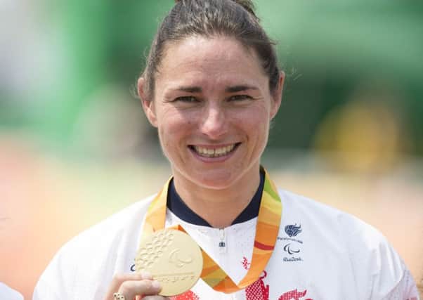 20160914 Copyright onEdition 2016?
Free for editorial use image, please credit: onEdition

Cyclist Dame Sarah Storey DBE (C4-5) from Manchester,  wins a gold medal for ParalympicsGB in the Woman's Road Cycling Time Trail C5 at the Rio Paralympic Games 2016.
 
ParalympicsGB is the name for the Great Britain and Northern Ireland Paralympic Team that competes at the summer and winter Paralympic Games. The Team is selected and managed by the British Paralympic Association, in conjunction with the national governing bodies, and is made up of the best sportsmen and women who compete in the 22 summer and 4 winter sports on the Paralympic Programme.

For additional Images please visit: http://www.w-w-i.com/paralympicsgb_2016/

For more information please contact the press office via press@paralympics.org.uk or on +44 (0) 7717 587 055

If you require a higher resolution image or you have any other onEdition photographic enquiries, please contact onEdition on 0845 900 2 900 or email info@onEdition.com
This image is cop