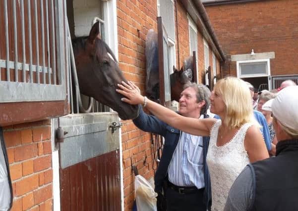 CHRISTMAS GIFT IDEA -- this behind-the-scenes visit to the Newmarket stable of Sir Michael Stoute was just one of the benefits of membership of The Racegoers Club.