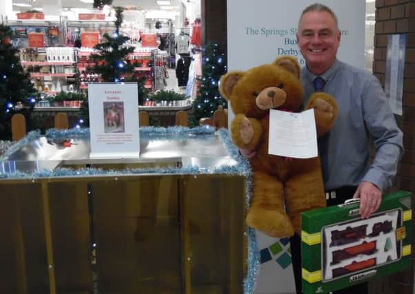 The Springs centre manager Carlon Stewart with some of the donated gifts.