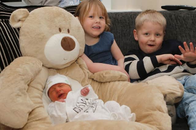 New Year baby Stanley Grindey with brother Harrison and sister Emily