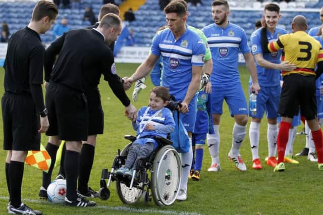 Lucas Stafford with the Stockport County players when he was mascot for a day. Photo: Stockport County FC Mike Petch @mphotography