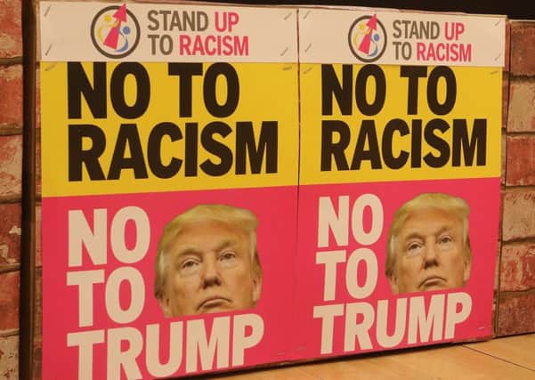 Campaigners build a "Wall of Solidarity" to mark concerns over US President Donald Trump's divisive policies.