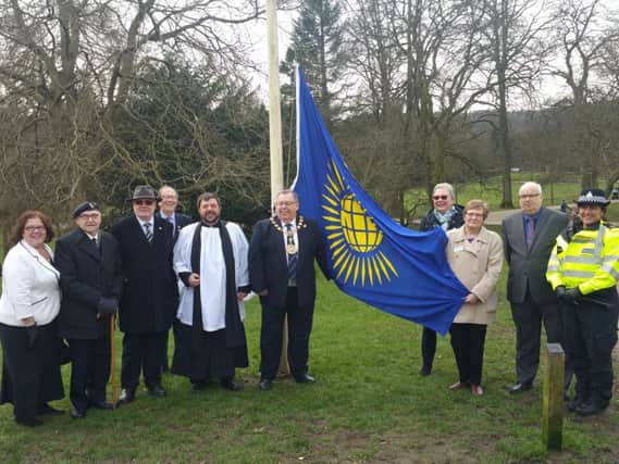 High Peak Mayor George Wharmby and community representatives at the flag-raising in the Pavilion Gardens, Buxton, to mark 'Fly a Flag for the Commonwealth' day.