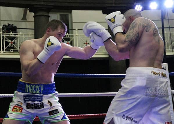 Jack Massey (left) on his way to an explosive first-round victory over Russ Henshaw at the Devonshire Dome.