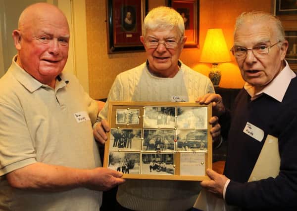 Former St Ann's staff members Brian, Colin and John Murphy with old staff photos.