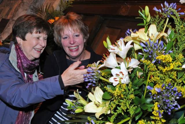 St. Michael and All Angels Church flower festival, Tadington.
Janet Quier, left and Olwen Kirkwood admire one of the displays titled, Spring.