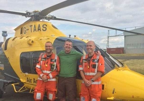 Dave meeting the air ambulance crew who saved his life with their quick response last year.