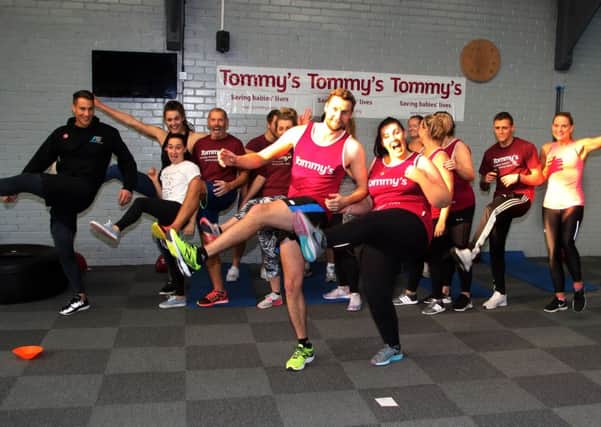 James and Amy Hawtin (centre) join in one of the exercise classes.
