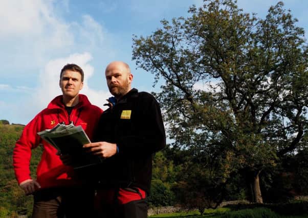 National Trust Ranger Luke Barley (in red) and Joe Alsop from Natural England near Monsal Dale. Photo: David Bocking.