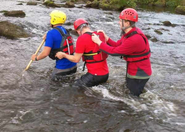 Buxton Mountain Rescue Team's water rescue personnel in training.