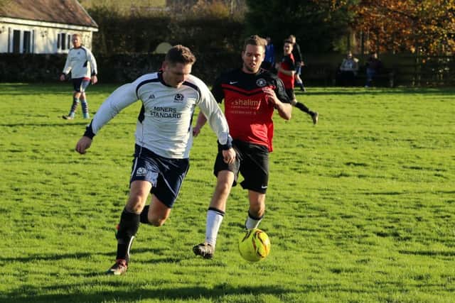 Action from the charity match.
