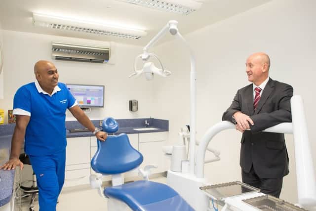 Divesh Singh, Principal Dental Surgeon and owner of High Street Smiles, and Mike Scott, Relationship Manager at Yorkshire Bank. Photo contributed.