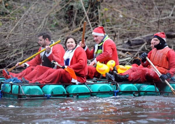 Matlock Boxing Day raft race.                                   
These Santa's sleigh proves it's worth through the rapids.