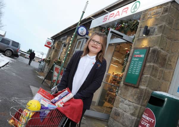 Alice Hague was over the moon to receive her own shopping trolley courtesy of Whites Spar in Calver.