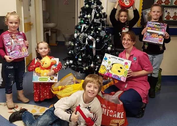 Rhys Mellor collected 59 new toys and delivered them to the childrens ward at Stepping Hill Hospital.