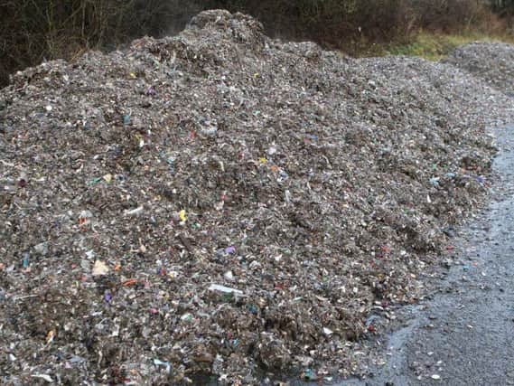 Piles of waste have been dumped in a lay-by off the road known as the 13 bends.