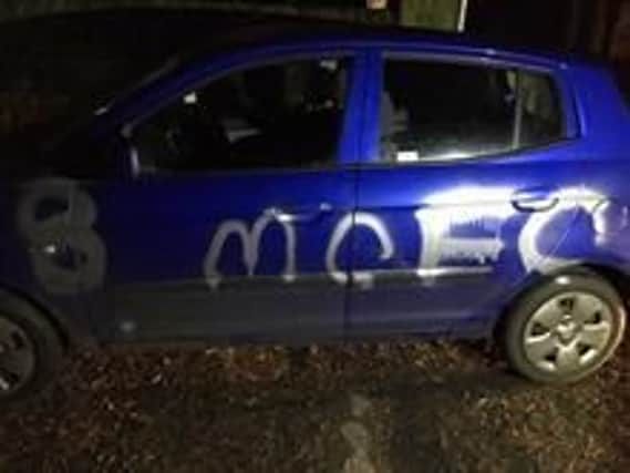 The car was sprayed with paint