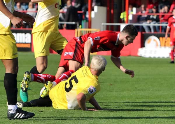 Alfreton's goalscorer Ryan Jennings (red) pictured here earlier in the season