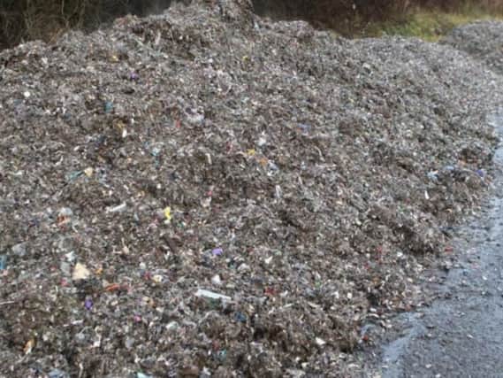 Piles of waste have been dumped in a lay-by off the road known as the 13 bends.