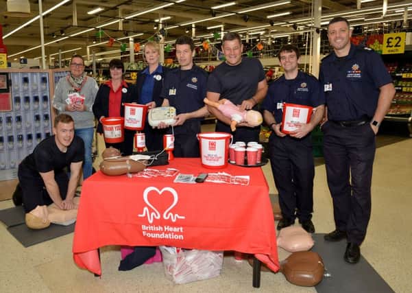 Ilkeston firefighters hosted a 12 hour CPR Marathon fundraiser for the BHF. Pictured are firefighters Dan Davies, Darren Bishop, Mark Burnham, Steve Blackett and Steve Cook, Jayne Clifford regional support manager for BHF and Tesco staff members Sarah Barnatt and Liz Wright.