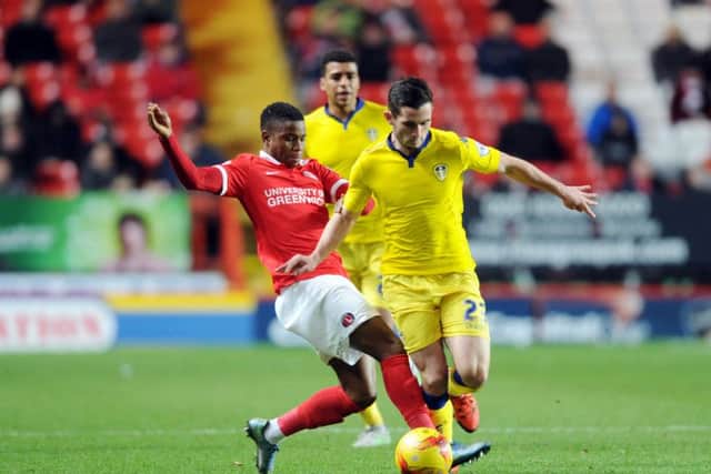 Lewis Cook challenged by Ademola Lookman, then at Charlton on loan.