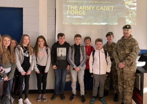 Adult volunteers from the army cadet force at Buxton Community School.
