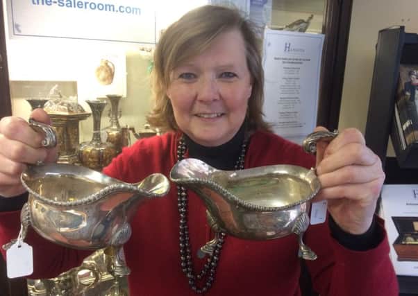 Sonia Jckson with silver sauce boats found in Buxton.