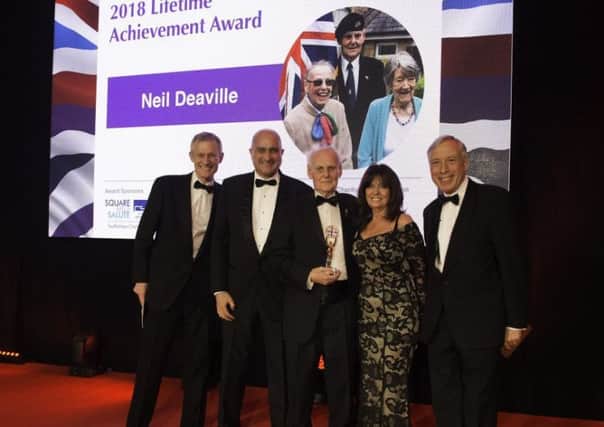 Event hosts Jeremy Vine and Vicki Michelle MBE with Brett Lovegrove, award sponsor and chief executive of CSARN, Neil Deaville and the Rt Hon Earl Howe, charity patron of the Soldiering On Awards.