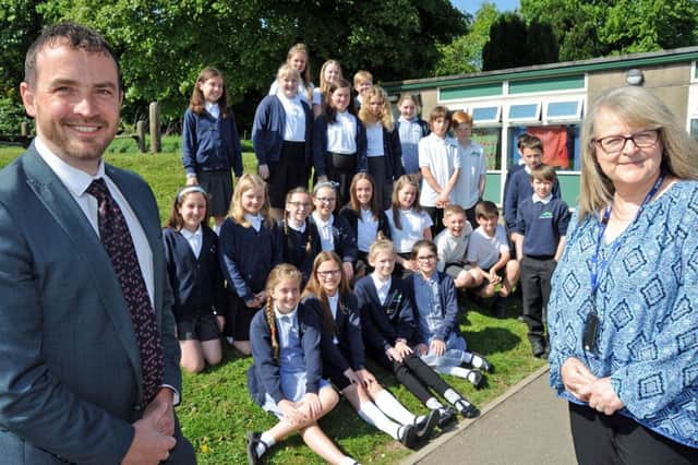 Head teacher, Anthony Tierney and his deputy Alison Ling pictured with house captains and prefects from year 6 at the Burbage Primary School, who are celebrating their good ofsted report.
