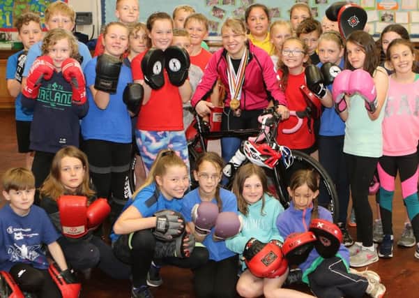 Ex-Chinley Primary School pupil, para-cyclist Katie Toft, meeting some of the pupils trying kick boxing. Photos by Jason Chadwick.